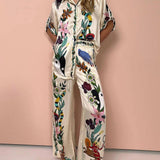 Olimpia | Completo camicia e pantaloni in satin con stampa unica, stile Resort