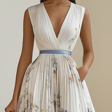 Camilla | Abito midi plissettato in chiffon floreale bianco con scollatura a V